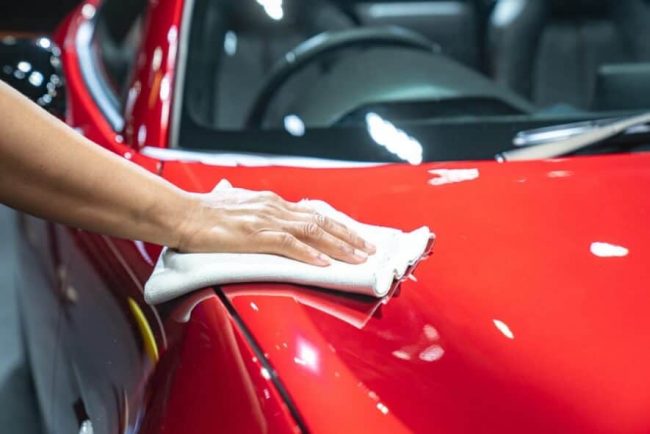 A Person cleaning the car